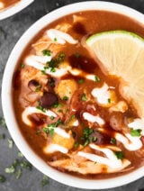 This Crockpot Chicken Taco Soup comes together in a matter of minutes, is healthy, gluten free, and full of veggies, lean chicken, plenty of texture, and loads of spices! showmetheyummy.com #crockpotsoup #tacosoup