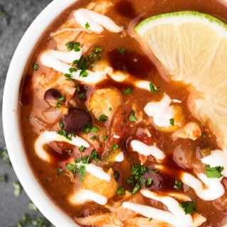 This Crockpot Chicken Taco Soup comes together in a matter of minutes, is healthy, gluten free, and full of veggies, lean chicken, plenty of texture, and loads of spices! showmetheyummy.com #crockpotsoup #tacosoup