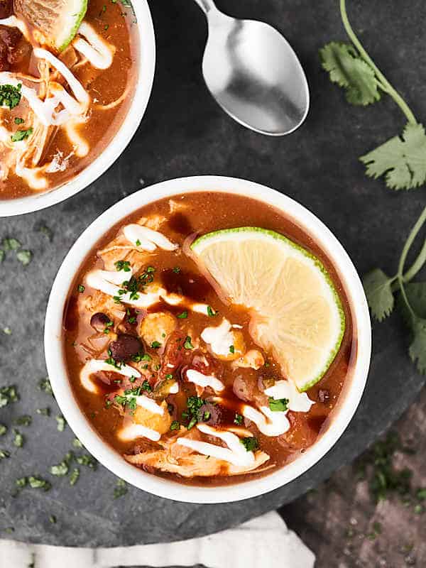 crockpot chicken taco soup in bowl above 