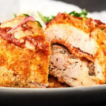 A healthy version of a favorite classic, these Pizza Stuffed Chicken Roll-Ups are only 245 calories and actually taste like pizza! Full of mozzarella, turkey pepperoni, and veggies! showmetheyummy.com #healthypizza #stuffedchicken