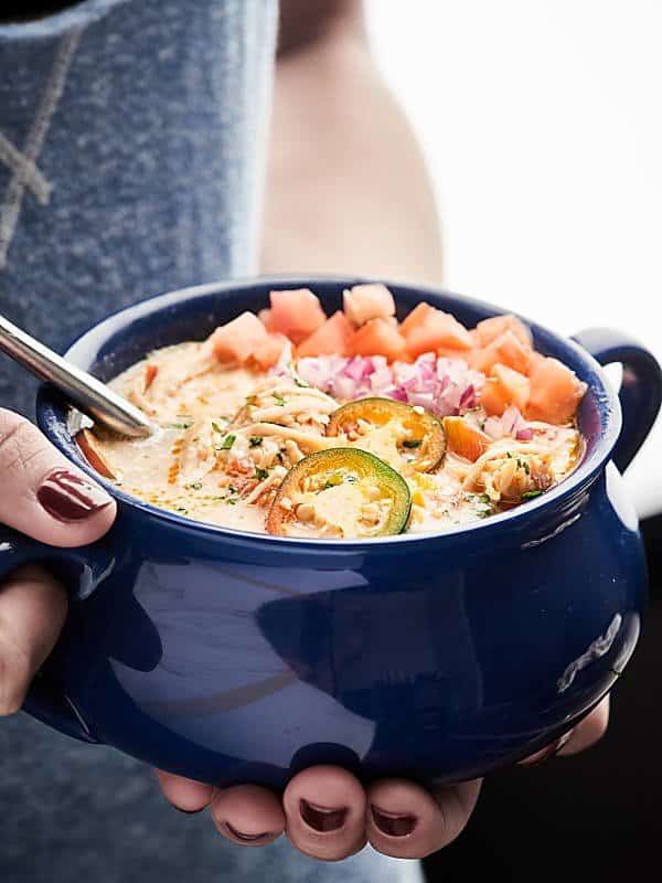 bowl of slow cooker white chicken chili held