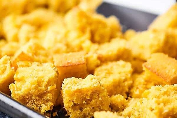 An easy gluten free stuffing, this Cornbread Dressing Recipe will surely impress! Full of italian sausage, vegetables, homemade cornbread, cranberries, spices, and more! showmetheyummy.com #cornbreaddressing #cornbreadstuffing