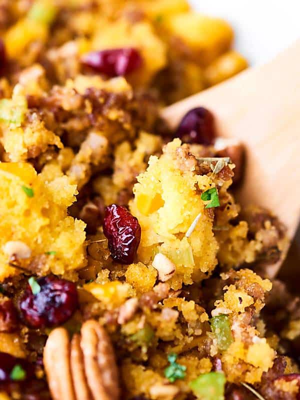 An easy gluten free stuffing, this Cornbread Dressing Recipe will surely impress! Full of italian sausage, vegetables, homemade cornbread, cranberries, spices, and more! showmetheyummy.com #cornbreaddressing #cornbreadstuffing