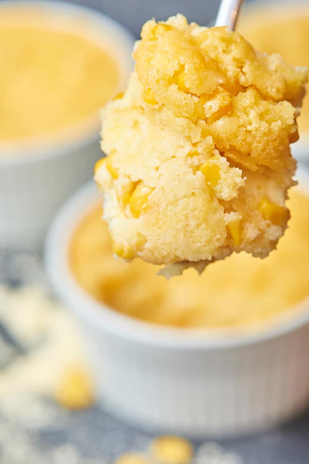 This creamy corn casserole tastes like an extra creamy cornbread that you eat with a spoon! It’s the perfect Thanksgiving side dish. The bonus? It’s so easy! Just dump all the ingredients together in a bowl, stir, and bake! https://showmetheyummy.com #thanksgiving #corncasserole 