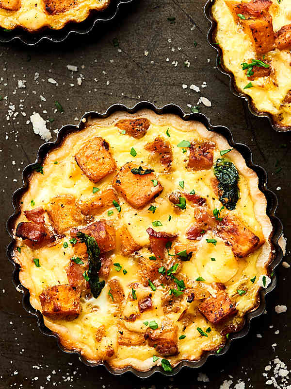 #ad An Easy Cheesy Bacon Breakfast Tart Recipe full of crispy bacon, smoky gouda, and creamy sweet potatoes! Made ultra easy with store bought pie dough! Recipe made in partnership w/ @jonesdairyfarm #JonesFamilyRules