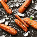 A healthy-ish side dish that's perfect for any occasion! You're only 10 ingredients and 30 minutes away from devouring these super simple and delicious Honey Roasted Carrots! showmetheyummy.com #thanksgiving #honeyroastedcarrots