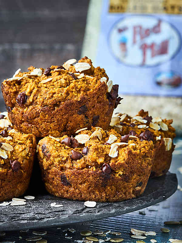 skinny pumpkin muffins stacked on plate