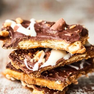 Add this Christmas Crack (aka Easy Saltine Toffee Candy) to your holiday baking list! Only 6 ingredients necessary to make the most addicting holiday treat yet! It's the perfect combo of sweet/salty/crunchy! showmetheyummy.com #christmas #candy #christmascrack #saltinetoffee