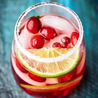 Sweet, tart, and perfect for the holidays, this Easy Cranberry Pomegranate Margarita can be enjoyed by one or shared with many! Only 5 ingredients necessary! showmetheyummy.com #cranberrymargarita #pomegranatemargarita
