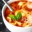 #ad A light vegetarian soup loaded with cheesy pasta, tomatoes, and spices, this Crockpot Tomato Tortellini Soup is quick to put together and is a sure crowd pleaser! showmetheyummy.com Made in partnership w/ @redgoldtomatoes #crockpotsoup #tortellinisoup