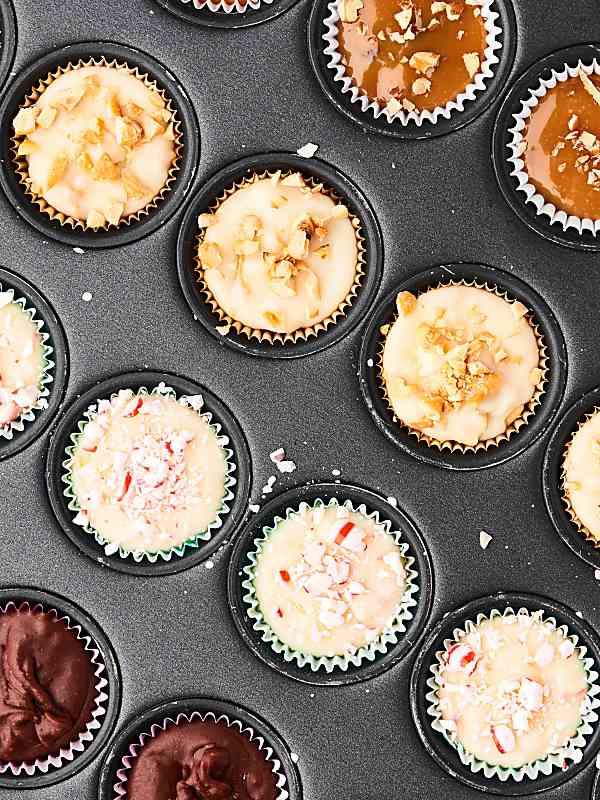 This Easy Microwave Fudge Recipe can be made into FOUR different flavors: peppermint, chocolate, turtle, and maple! Made in a mini muffin tin to make the perfect bite sized treats. showmetheyummy.com #microwavefudge #christmascandy