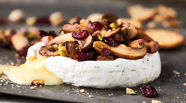 #ad The BEST appetizer yet, this Mushroom Brut Brie is totally impressive, ridiculously easy, and ultra cheesy! Melty brie is topped with brut champagne, buttery mushrooms, and crunchy pistachios! showmetheyummy.com Made in partnership w/ @barefootwine #mushrooms #brie