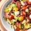 This Antipasto Chicken Salad Recipe only takes 10 minutes to put together and is full of all your favorite antipasto ingredients: pepperoni, mozzarella, basil, roasted red peppers, and more! showmetheyummy.com