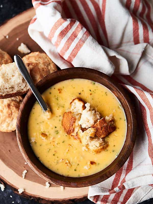parmesan drop biscuit in bowl of soup above
