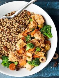 This Easy Moroccan Chicken is a one pot wonder full of tender chicken, sweet carrots, crunchy broccoli, salty olives, and chewy raisins! The perfect dinner for two! showmetheyummy.com