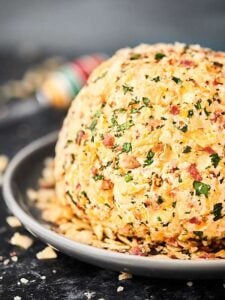 #ad A twist on a classic, this Potato Chip Cheese ball is full of cream cheese, goat cheese, cheddar cheese, bacon, spices, and yes, POTATO CHIPS! :) showmetheyummy.com @