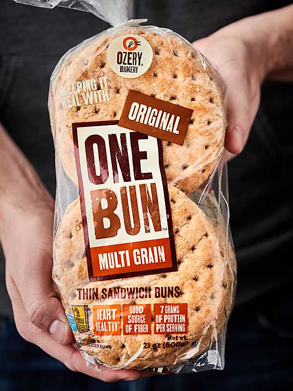 package of multi grain thin sandwich buns held