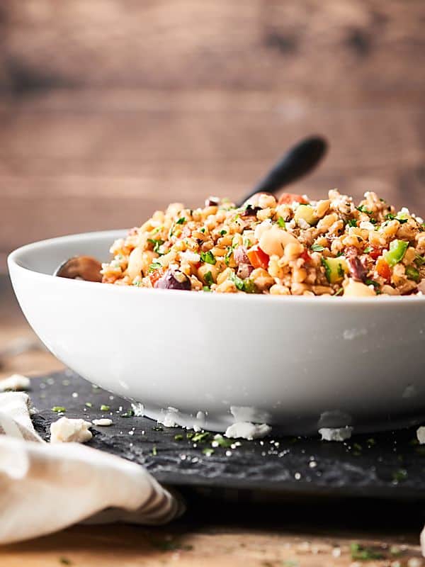 Bowl of mediterranean farro salad side view