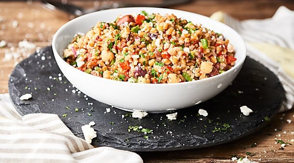 #ad Hearty farro meets loads of fresh, crunchy veggies, tangy red wine vinegar, chickpeas, and spices to make this healthy and delicious Mediterranean Farro Salad Recipe! showmetheyummy.com Made in partnership w/ @bobsredmill