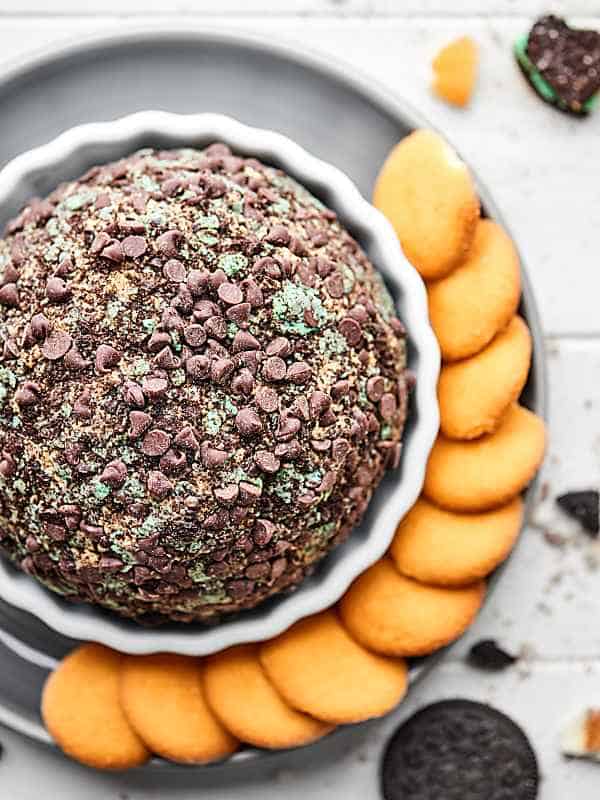 mint oreo cream cheese ball on plate with nilla wafers above