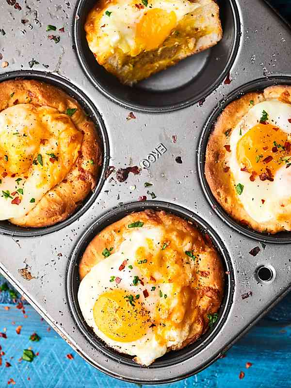 Biscuit cups in muffin tin above