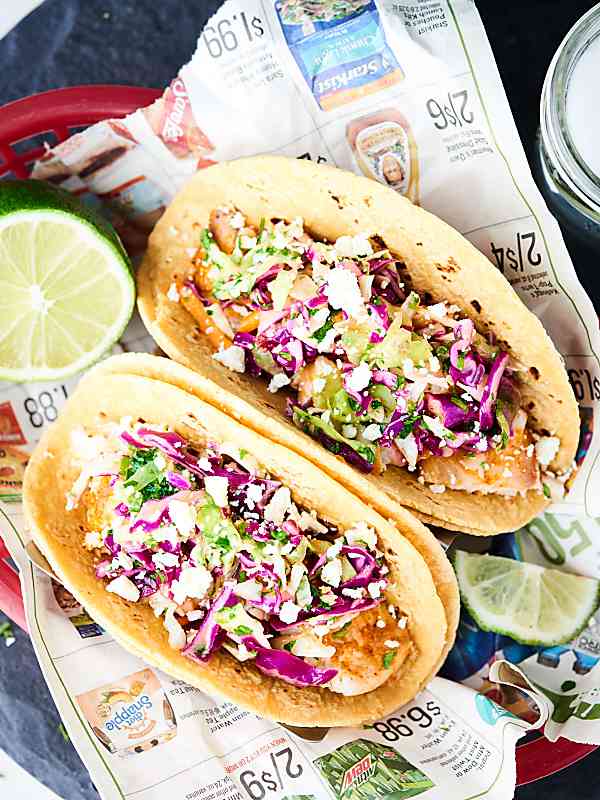 Two baked fish tacos above