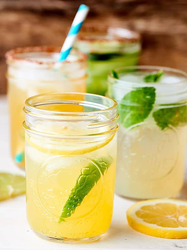 Four margaritas in jars from the side