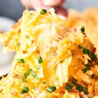 #ad Just when you thought mashed potatoes couldn't get better, I baked them into a dip to create this Cheesy Mashed Potato Chip Dip. Served with potato chips! showmetheyummy.com Made in partnership w/ @idahoanfoods