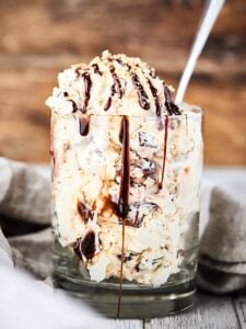 This No Churn Roasted S'Mores Ice Cream Recipe is insanely quick and easy to make and is loaded with hot fudge, roasted marshmallows, and crunchy graham crackers! Only 7 ingredients needed and NO ice cream machine required! showmetheyummy.com