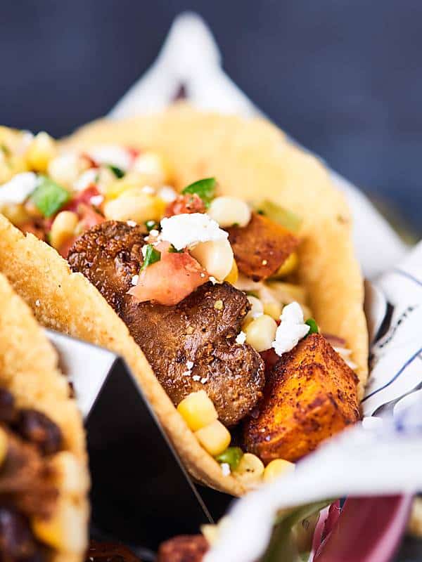 These Sweet Potato Tacos are gluten free, vegan, healthy, and oh yeah, absolutely DE-LICIOUS! Loaded with sweet potatoes, mushrooms, black beans, and spices - these hearty tacos will surely satisfy! showmetheyummy.com