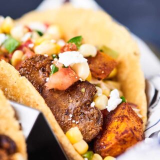 These Sweet Potato Tacos are gluten free, vegan, healthy, and oh yeah, absolutely DE-LICIOUS! Loaded with sweet potatoes, mushrooms, black beans, and spices - these hearty tacos will surely satisfy! showmetheyummy.com #vegan #taco