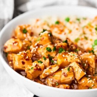 This Crockpot Sesame Chicken is a more flavorful, health-i-fied version of a take-out classic! One of my go-to throw and go, quick and easy recipes! showmetheyummy.com #crockpot #sesamechicken #healthy