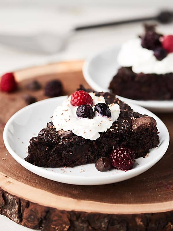 Two slices of chocolate cake on plate