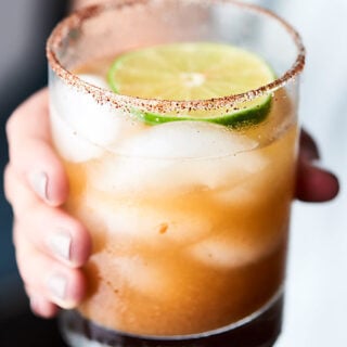 #ad This Tamarind Margarita Recipe is a unique twist on a classic! Full of tamarind paste, lemon juice, lime juice, agave, and tequila and lined with a chili salt rim! showmetheyummy.com Made in partnership w/ @nutsdotcom