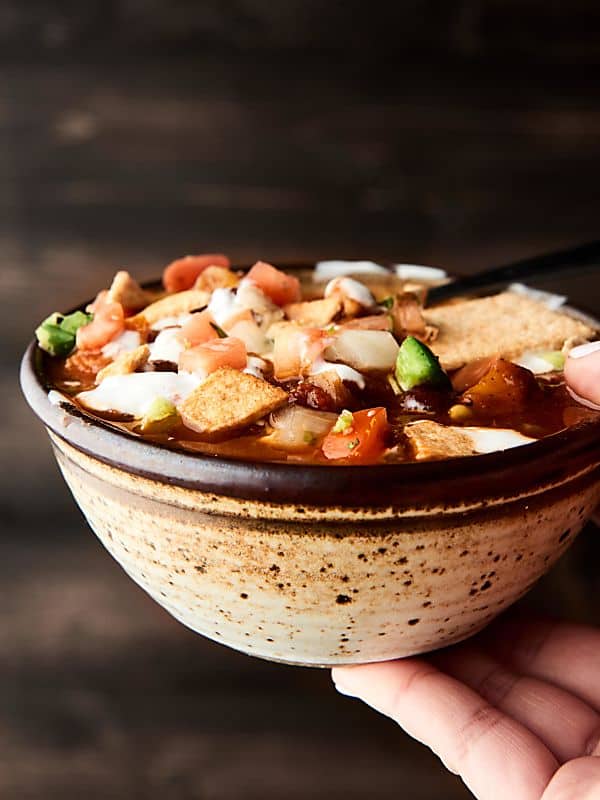 This Crockpot Vegetarian Chili is vegan, gluten free, SO healthy, and loaded with veggies, spices, and THREE kinds of beans! showmetheyummy.com