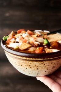 This Crockpot Vegetarian Chili is vegan, gluten free, SO healthy, and loaded with veggies, spices, and THREE kinds of beans! showmetheyummy.com #vegan #vegetarian #chili #crockpot #slowcooker #glutenfree
