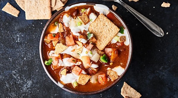 This Crockpot Vegetarian Chili is vegan, gluten free, SO healthy, and loaded with veggies, spices, and THREE kinds of beans! showmetheyummy.com