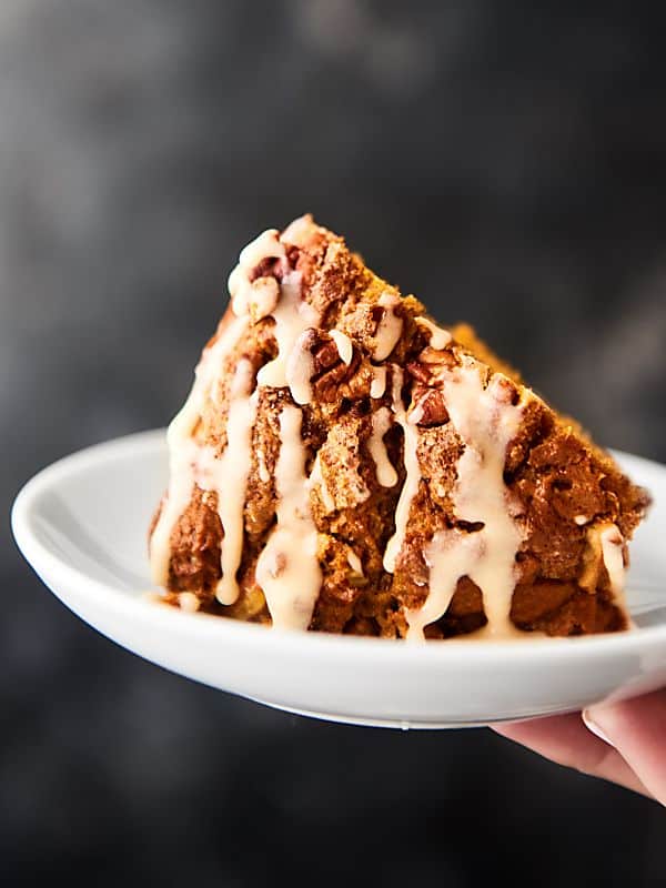 slice of pumpkin coffee cake on plate held