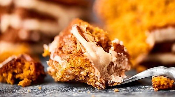 This Easy Pumpkin Coffee Cake is perfect for your fall breakfasts and brunches! Spice cake mix + pumpkin puree, cinnamon, pecans, and a maple icing! showmetheyummy.com