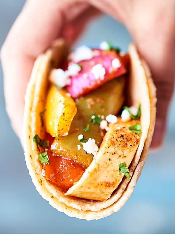 These Sheet Pan Chicken Fajitas are healthy, gluten free, and full of veggies, tender chicken, and spices! Minimal clean up for an easy weeknight dinner! showmetheyummy.com