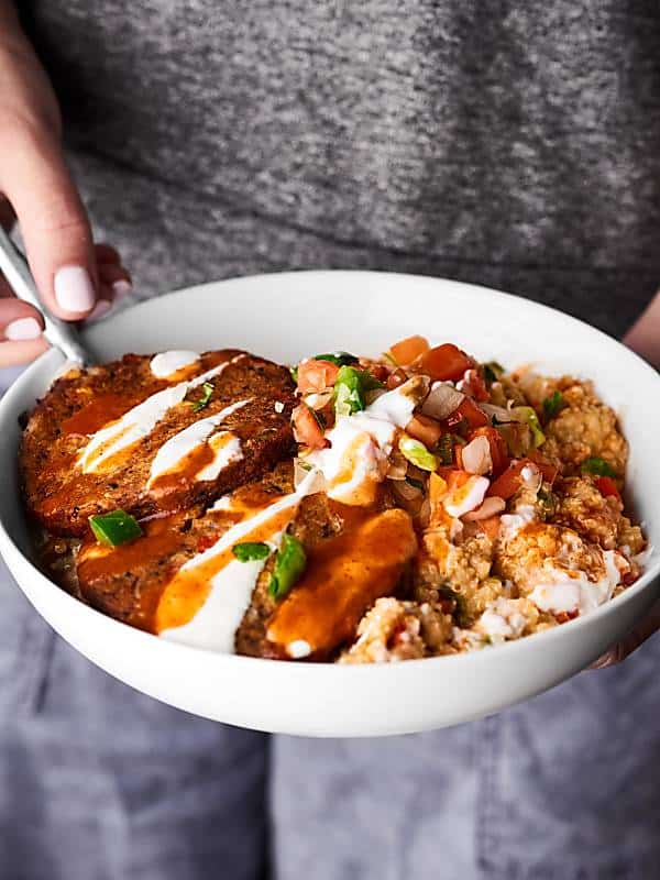 vegetarian enchilada bowl held