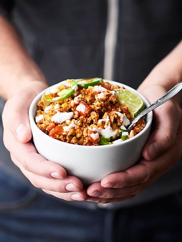 Bowl of taco cauliflower rice held