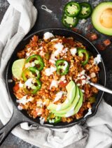 This Taco Cauliflower Rice Skillet is quick, easy, healthy, low carb, and absolutely delicious! Loaded with ground turkey or chicken, vegetables, and frozen cauliflower rice! showmetheyummy.com