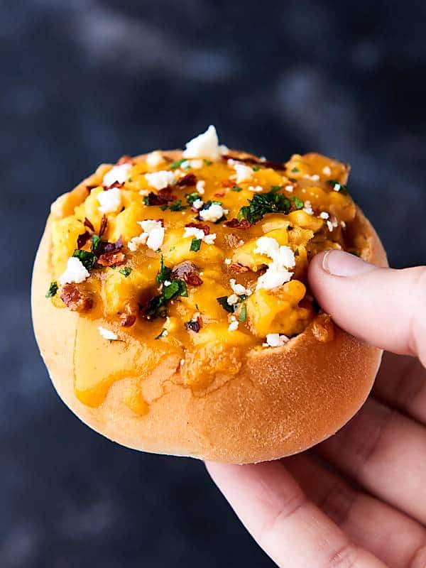 breakfast bacon bread bowl held