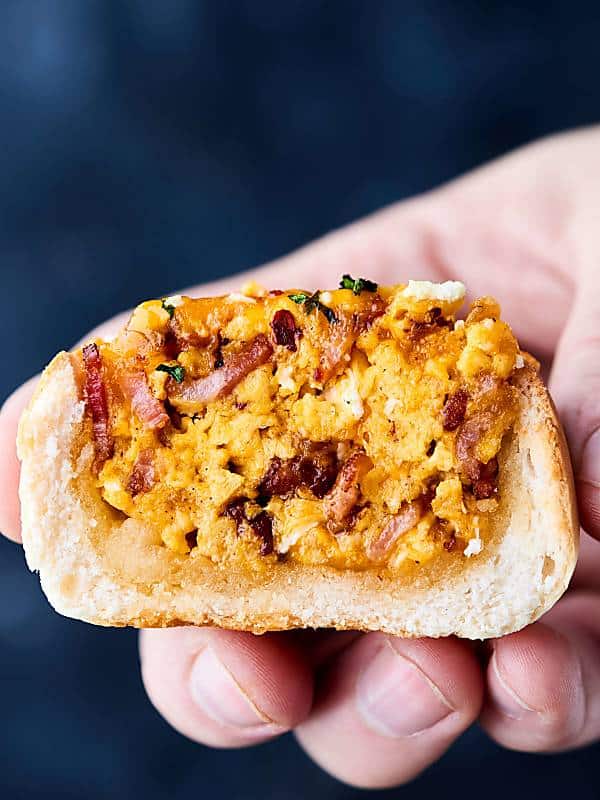 half breakfast bacon bread bowl held