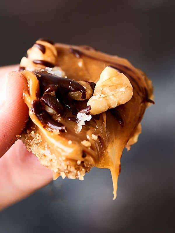 piece of caramel walnut tart held