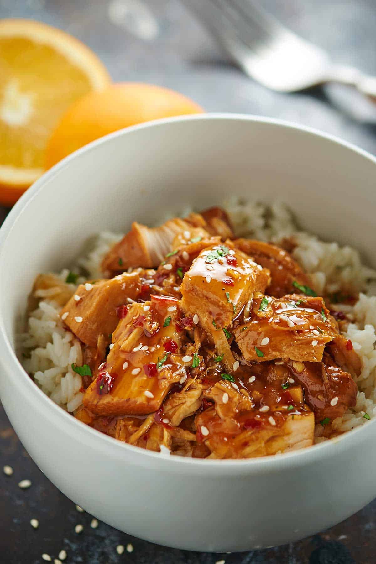 Crockpot orange chicken over rice in a bowl