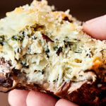 #ad Healthier Spinach Artichoke Stuffed Mushrooms, the perfect appetizer for easy entertaining! Mushroom caps stuffed with a greek yogurt spinach artichoke dip, topped with mozzarella, and baked to gooey perfection! showmetheyummy.com Made in partnership w/ @laterrafina