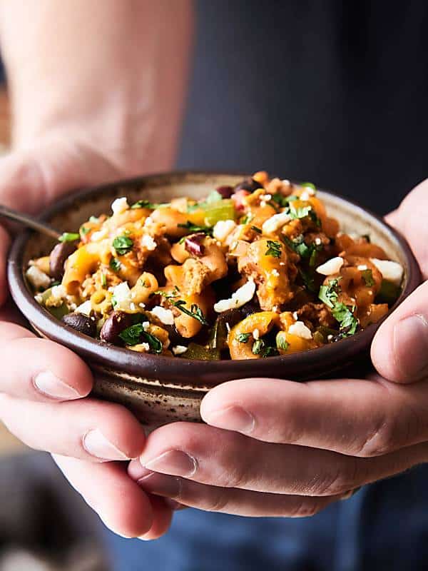 bowl of chicken chili mac held