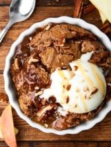 This Slow Cooker Caramel Apple Dump Cake Recipe might be my easiest recipe yet! Only 5 ingredients: apple pie filling, pecans, caramel, spice cake mix, and butter! showmetheyummy.com